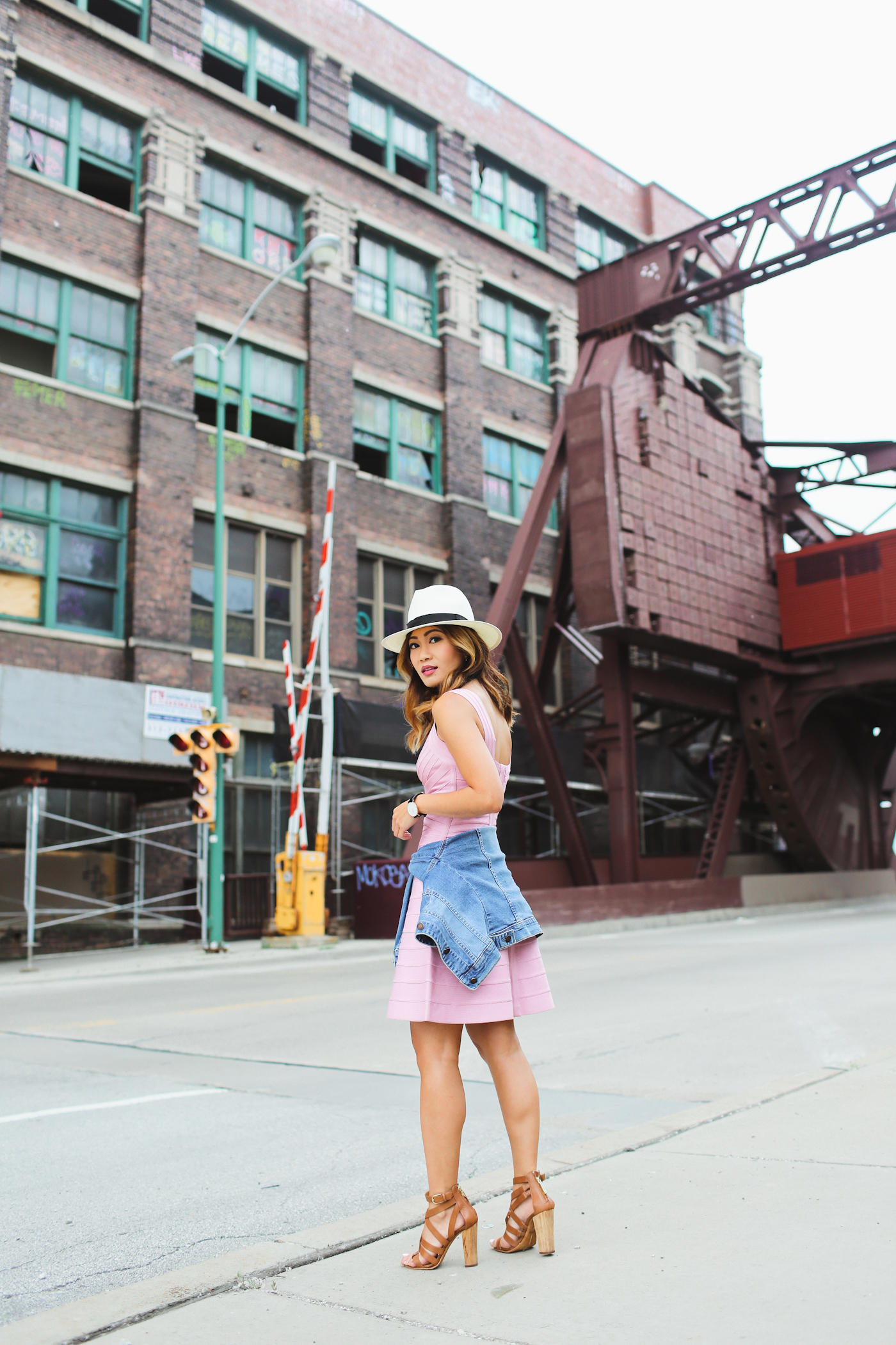 casua look in pink a-line herve leger dress and denim jacket