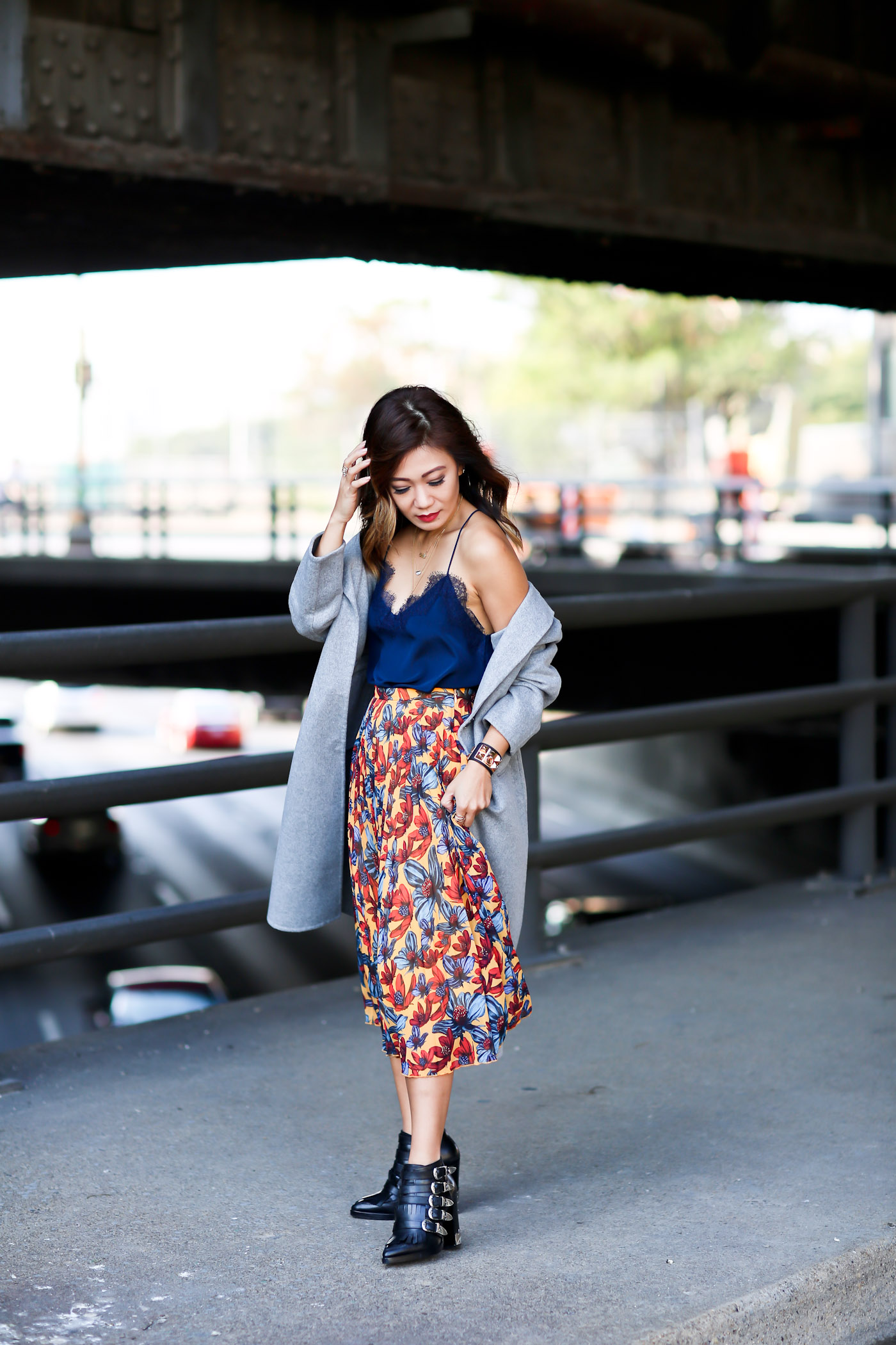 dressy lace cami with pleated skirt and oversized coat