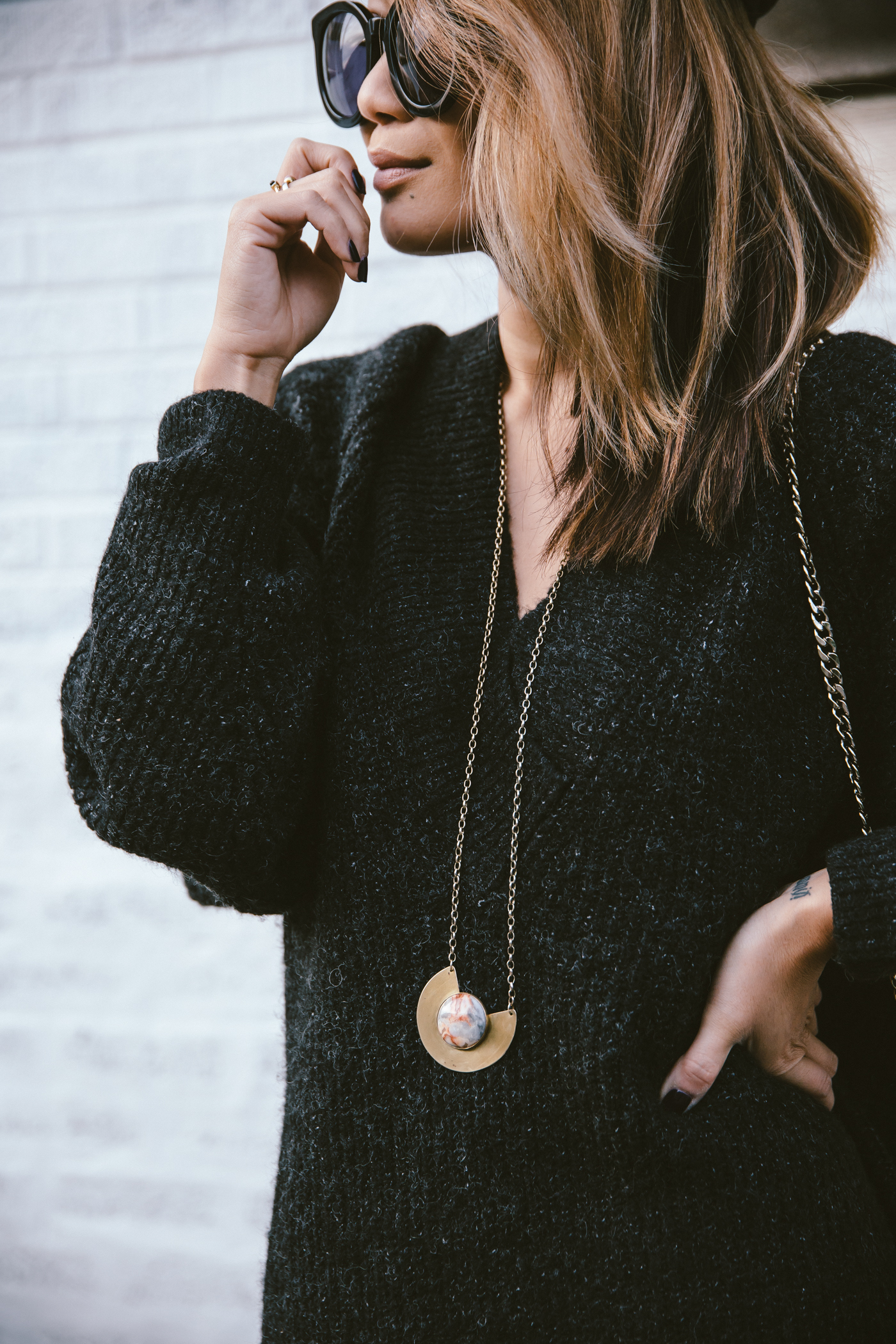 oversized sweater dress with christian louboutin ankle boots and leg warmers newsboy cap and jw anderson bow pierce bag