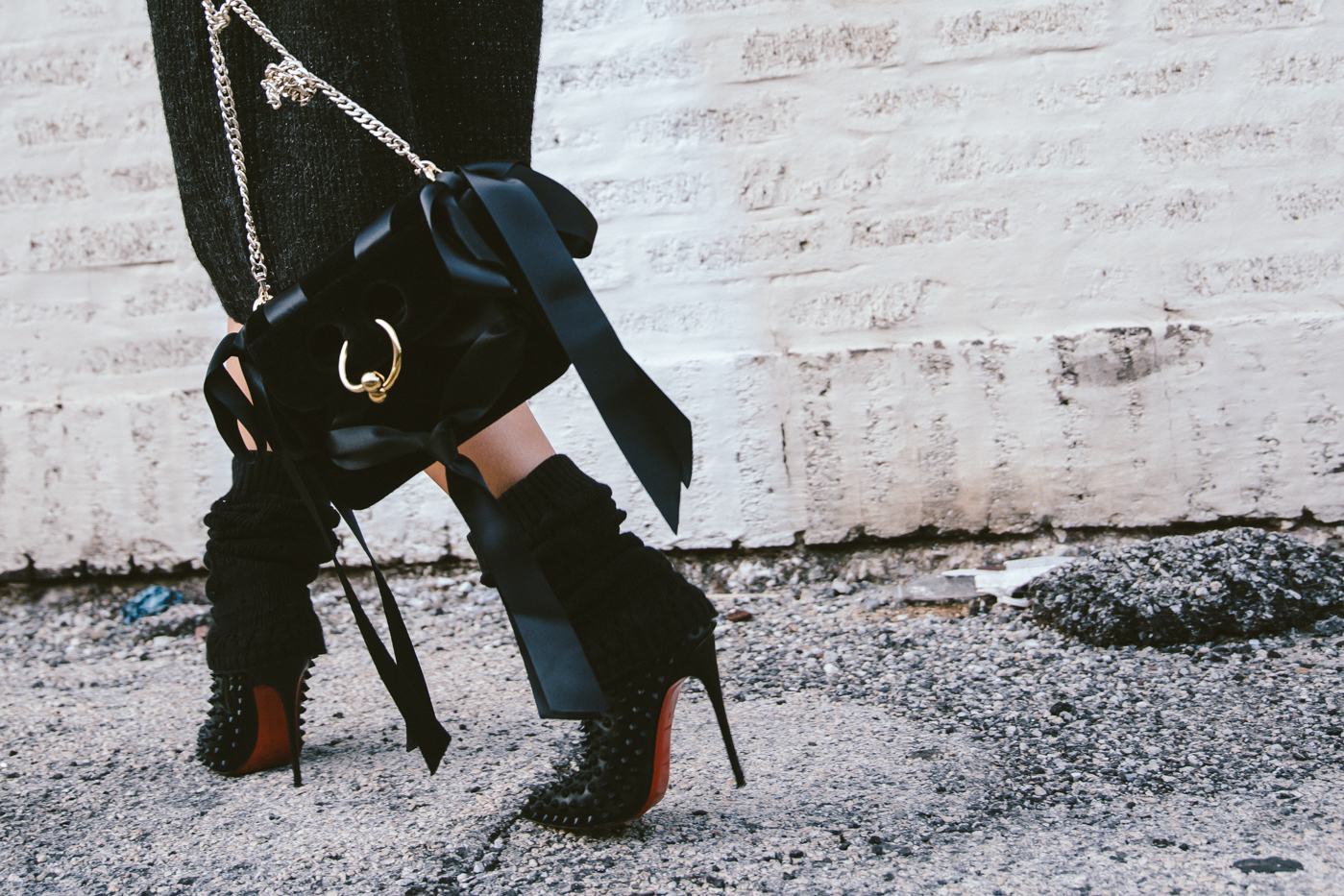 oversized sweater dress with christian louboutin ankle boots and leg warmers newsboy cap and jw anderson bow pierce bag