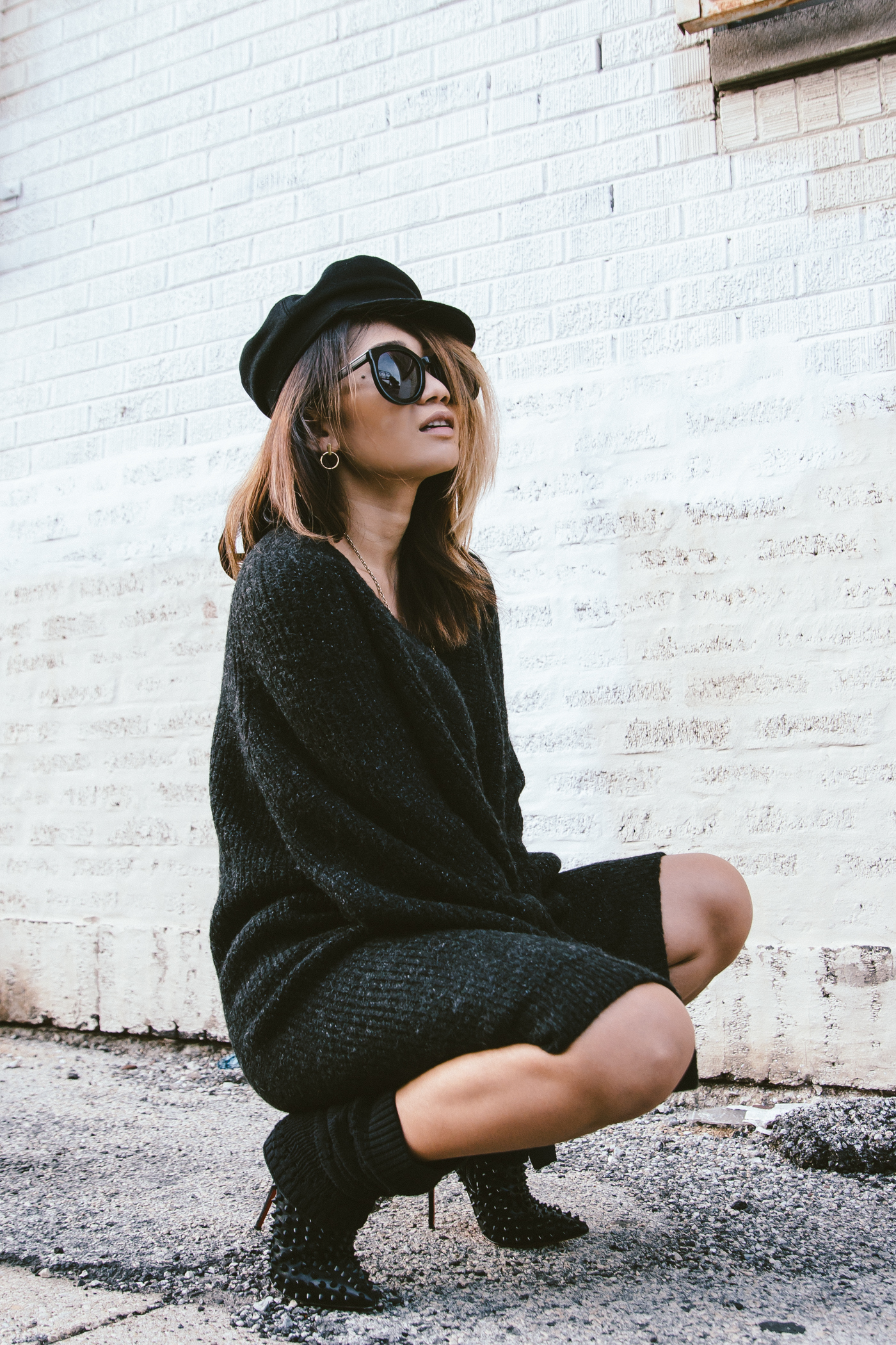 oversized sweater dress with christian louboutin ankle boots and leg warmers newsboy cap and jw anderson bow pierce bag