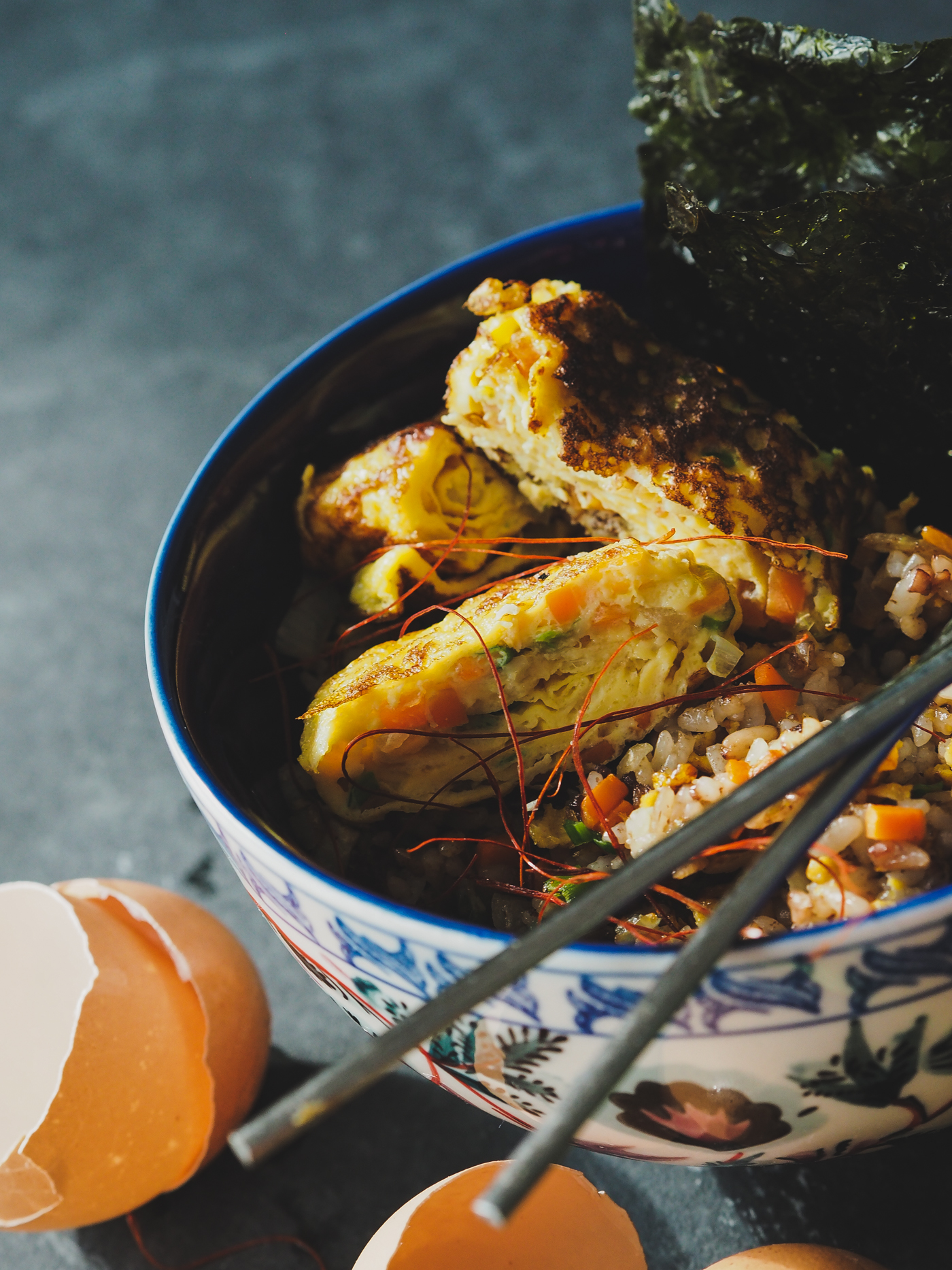 day old rice bowl with rolled egg and kimchi
